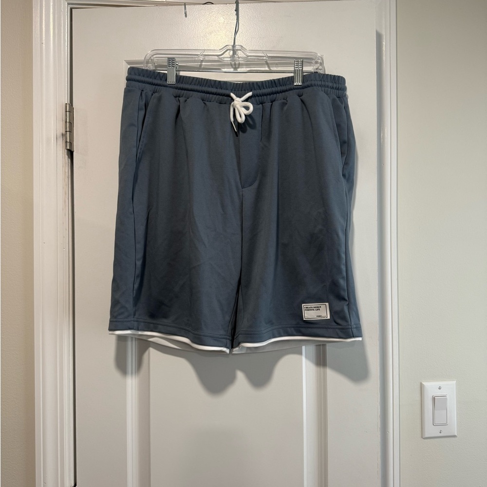 Blue Athletic Shorts with White Trim